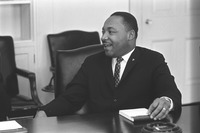 Photographer Yoichi Okamoto catches Martin Luther King with a rare smile during a meeting with President Johnson on the proposed Civil Rights Act legislation.