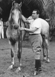 An avid horseman in the 1930s, Batista appears to be preparing his horse for a ride. Batista frequently went horseback riding with U.S. Ambassador Jefferson Caffery as a prelude to conducting state business.