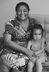 Photograph of Daiane and her granddaughter in the new apartment.