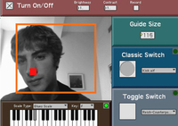 Screenshot, a person’s face is in the middle of the AUMI interface screen. A red outline of a rectangle is on the screen, as well as a red dot, which is in front of the person’s nose.