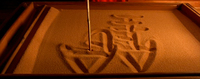 close-up of writing in sand