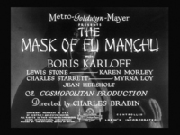 A mask has English title and actor credits text superimposed over it.