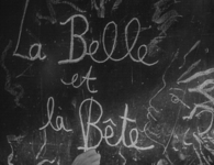 The film's white titles are chalked next to a drawing of a face. They're drawn on a chalkboard, which includes scribbles of chalk.