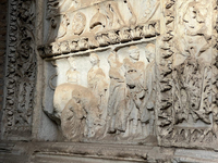 Frieze from ornamental gate, depicting six figures and a bull. The figures carry sacrificial equipment and are preparing to sacrifice the bull. At left and right, vegetal material serves as decoration while instruments of sacrifice create a border above.
