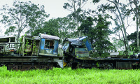 Contemporary photograph of ruined trains, Mbanza Ngungu