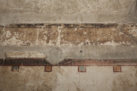 Fig. 3.15. Room 25, west wall, detail of frieze above right-hand pavilion. Photo: P. Bardagjy.