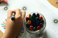 Fig. 30. A photograph of a person coloring with crayons.