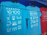 A photograph of a T-shirt for sale printed with the Pakatan Harapan manifesto