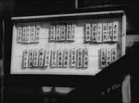 0:42:03, Chinese characters of the orphan's names are written on wooden blocks,