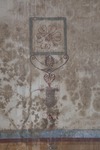 Fig. 3.8. Room 25, west wall, detail of candelabrum supporting floral plaque. Photo: P. Bardagjy.