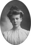 H.D. as a young woman with upswept hair.