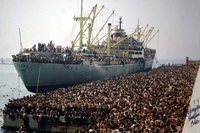Photograph of a crowd of Albanians onboard the Vlora cargo boat seeking refuge in Bari, Italy, August 1991.