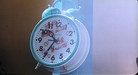 Red handwriting on a clock