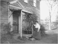 Helen Keller at the back door of her Wrentham home, 1909.