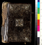 A hard cover of a book with an ornament on its center. A color bar is placed on the left.