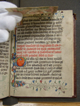 Figure 2 shows an archivist’s gloved hand raising a small parchment image. This image has been sewn over the top edge of a page in the fifteenth-century manuscript known as the Pavement Hours. The manuscript is a small book approximately 215 x 162 mm in size. The page in this photograph contains precisely written text and decorative embellishments. This photograph depicts the interaction with the book that a sewn image can facilitate.