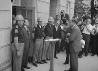 Fig. 17. A photograph showing Alabama governor George Wallace attempting to block the integration of the University of Alabama in 1963.