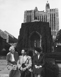 H.D., Norman Holmes Pearson and Bryher sit in front of the ivy-covered Sterling Library at Yale University.