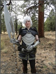 A young thin white man is in a realistic costume as Fenris from Dragon Age 2.