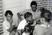Activist/author/folksinger Julius Lester plays guitar and teaches Freedom Songs with Freedom School students at Mt. Zion Baptist Church in Hattiesburg during the Freedom Summer of 1964.