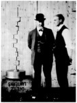Henry Ford and John S. Gray standing beside crankshaft of a Ford racing car, January, 1905