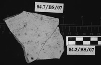 Fig 53a: Ostraka 45 inscribed on concave side only, obliquely to the throwing marks. Sherd is broken into two pieces (53a) and is heavily soiled. It is broken off at left-hand (53b) and top right-hand sides (53c). Text is uncertain.
