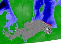 Screen shot of wind-generated spread simulation generated by the GRASS 6 anisotropic wildfire spreading module. The spread is shown as grey-patterned area beginning at the southeastern coast of the Jutland peninsula and extending progressively eastward.