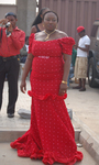 Front view of a woman wearing red aso ebi.