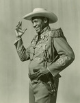 Paul Robeson in the 1939 tour revival of The Emperor Jones retooled for Depression era audiences. He wears a cowboy hat and gun in a studded holster.