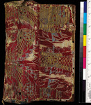 A small portion of a tan parchment with Greek lettering in red. Ornamentation covers the entire page.