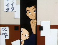 Two kids peer through the crack in the fusama, upon which are calligraphy practice sheets, one of which has the characters for "Father" and "Mother."