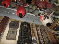 Photograph of numerous prop lanterns and boards.
