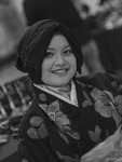 Mimie wears a dark cloth over her head to represent Tamayo’s hairstyle, and a floral kimono.