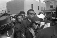Stokley Carmichael, his wife singer Miriam Makeba, and activist Cleveland Sellers (dark glasses) walk down Atlanta’s Auburn Avenue with mourners during the funeral procession for Martin Luther King Jr, April 9, 1968.