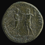 Photograph of sestertius of Vespasian. Reverse: Victory advancing right holding palm in left hand, offering Palladium to Vespasian.