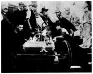 Twelve Ford employees at the Mack Avenue Plant as the 1904 racer is made ready for Frank Kulick. (On extreme left, P. E. Martin; in shirtsleeves and cap, August Degener)