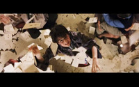 A young Harry Potter leaps to grab an envelope