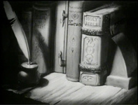Image of the books (the bible, the Confucius, the Kuran) on a shelf