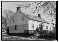 Black and white photograph of a historic house.