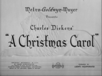 Title screen for "A Christmas Carol" in black English calligraphic type with copyright and production labels at the bottom of the screen. The text is superimposed over an off-white image of an embossed lion.