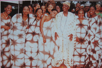 A group of women wearing aso ebi.