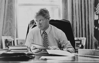 Fig. 24. A photograph of President Clinton at his desk.