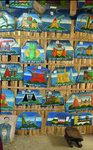 Roy Cortez’s carvings hung in rows on a wall.