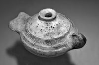 Fig 62: Inscribed Material from Bīr Shawīsh 4 is a ceramic oil lamp with the name Apollos. Lamp is having dimensions of height at 56 mm, handle to spout length at 79 mm.