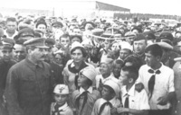 Josef Stalin (left) with a group of air-minded Soviet children at Tushino airfield in Moscow, ca. 1936.