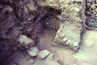 Photo of Structure 8, a cobblestone burial cist, after its contents had been removed.