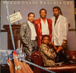 The first of two album covers placed one after the other: one for World Class Wreckin’ Cru, Rapped in Romance (1986), which shows its four group members wearing luxurious, sequined outfits in a formal indoor setting, and the other the aggressive cover of N.W.A., Straight Outta Compton (1988), which shows six men in street wear, staring down at the viewer, with one pointing a hand gun.