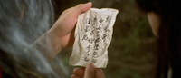 Closeup of a handwritten note on a piece of cloth.