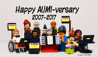 Color photo: 10 Lego people face forward, standing or seated, some in wheelchairs. Several display instruments: AUMI devices, keyboard, drums. A white-­haired Lego accordionist is front and center