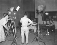 Iva Toguri reenacts her wartime radio broadcasts for an Army signal corps film crew.